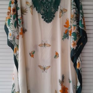 Floaty fabric with dreamy flowers and butterflies decorate this beautiful longer length kaftan.