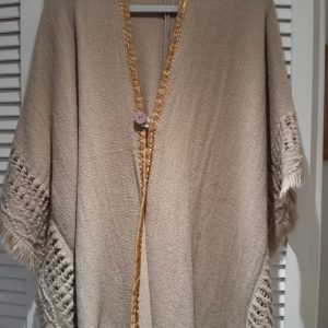 Poncho - Taupe with cream fringe and button fastening